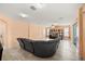 Bright living room featuring tile floors, recessed lighting, and a large sectional couch for relaxing and entertaining at 2512 Chapala Dr, Kissimmee, FL 34746