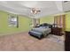 Bright main bedroom with tile flooring, a ceiling fan, and large windows offering plenty of natural light at 2512 Chapala Dr, Kissimmee, FL 34746