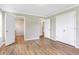 Spacious bedroom with wood floors, dual closets, and easy access to the bathroom at 28 N Osceola Ave, Center Hill, FL 33514