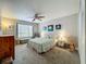 Serene bedroom with a plush bed, soft decor, and natural light from the window at 305 West Lake Faith Dr # 139, Maitland, FL 32751