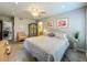 Comfortable bedroom featuring soft bedding, light fixtures, and neutral decor at 305 West Lake Faith Dr # 139, Maitland, FL 32751