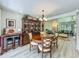 Dining room featuring a wooden table set and a large cabinet at 305 West Lake Faith Dr # 139, Maitland, FL 32751