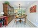 Dining room featuring a wooden table set and a large cabinet at 305 West Lake Faith Dr # 139, Maitland, FL 32751