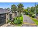 Beautifully landscaped condo community with palm trees, well-maintained grounds, and convenient street access at 305 West Lake Faith Dr # 139, Maitland, FL 32751