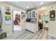 Hallway with a decorative display cabinet, leading to the living room and dining room at 305 West Lake Faith Dr # 139, Maitland, FL 32751