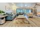 Inviting living room with comfortable seating, modern lighting, and access to outdoor spaces, perfect for relaxation at 305 West Lake Faith Dr # 139, Maitland, FL 32751