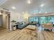 Spacious living room with large windows, comfortable seating, and stylish decor at 305 West Lake Faith Dr # 139, Maitland, FL 32751