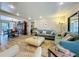 Open-concept living area featuring stylish furnishings, hardwood floors, and seamless flow to dining space at 305 West Lake Faith Dr # 139, Maitland, FL 32751