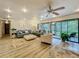 Spacious living room featuring modern furnishings, ceiling fan, recessed lighting, and a seamless indoor-outdoor flow at 305 West Lake Faith Dr # 139, Maitland, FL 32751