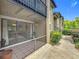 Relaxing screened patio with tiled flooring and views of the lush landscaping at 305 West Lake Faith Dr # 139, Maitland, FL 32751