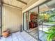 An inviting patio with tile flooring that offers a glimpse into the home's interior at 305 West Lake Faith Dr # 139, Maitland, FL 32751