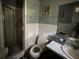 Bathroom featuring a toilet, mirror, sink, and shower with a tile floor at 3540 Garland St, Mulberry, FL 33860