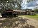 Charming ranch-style home featuring a well-maintained lawn and a welcoming facade at 3540 Garland St, Mulberry, FL 33860