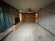 Spacious living room with tile floor, brick fireplace, and wood-paneled accent wall at 3540 Garland St, Mulberry, FL 33860