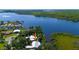 Picture of the waterfront property and community, surrounded by lush landscapes and a calm river at 418 Acacia Cir, Port Orange, FL 32127