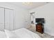Bedroom with closet featuring a ceiling fan, closet and view of second bedroom at 418 Acacia Cir, Port Orange, FL 32127