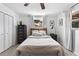 Bright bedroom with a ceiling fan, a window, and a closet providing ample light at 418 Acacia Cir, Port Orange, FL 32127