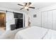 Comfortable bedroom featuring a ceiling fan, closet, and an ensuite bathroom at 418 Acacia Cir, Port Orange, FL 32127