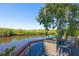 Deck featuring table and chairs overlooking the water at 418 Acacia Cir, Port Orange, FL 32127