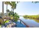 Deck featuring table and chairs overlooking the water at 418 Acacia Cir, Port Orange, FL 32127