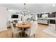 Bright open concept dining room adjacent to the living room and kitchen at 418 Acacia Cir, Port Orange, FL 32127