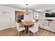 Cozy dining room with modern light fixture, hardwood floors and open concept layout at 418 Acacia Cir, Port Orange, FL 32127
