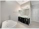 Bright bathroom featuring a soaking tub and double sink vanity at 4209 Sw 33Rd St, Ocala, FL 34474