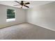 A cozy bedroom with carpet flooring and a window at 4209 Sw 33Rd St, Ocala, FL 34474
