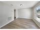 Comfortable bedroom features neutral paint and wood-look flooring, with a window offering natural light at 4209 Sw 33Rd St, Ocala, FL 34474