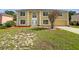 Two-story home featuring a manicured lawn and an attached two-car garage at 4209 Sw 33Rd St, Ocala, FL 34474
