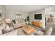 Comfortable living room features hardwood floors and a large-screen TV at 4209 Sw 33Rd St, Ocala, FL 34474