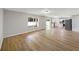 Open-concept living space with wood-look flooring and a kitchen view, great for entertaining and Gathering time at 4209 Sw 33Rd St, Ocala, FL 34474