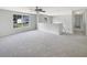 Upstairs loft area features a ceiling fan, large window, and soft carpet flooring for a comfortable space at 4209 Sw 33Rd St, Ocala, FL 34474