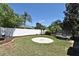 Spacious backyard with brick patio, lush landscaping, and privacy fence at 436 Skyview Pl, Chuluota, FL 32766
