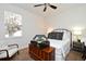 Bedroom featuring a bed with decorative pillows, side tables, chest of drawers and a window at 436 Skyview Pl, Chuluota, FL 32766