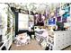 Whimsical bedroom decorated with floral garlands, fairy lights, posters, and layered textiles at 436 Skyview Pl, Chuluota, FL 32766
