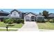 Charming home with a paved driveway, manicured lawn, and lovely landscaping at 436 Skyview Pl, Chuluota, FL 32766