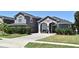 Charming home with a paved driveway, manicured lawn, and lovely landscaping at 436 Skyview Pl, Chuluota, FL 32766