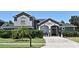Charming home with a paved driveway, manicured lawn, and lovely landscaping at 436 Skyview Pl, Chuluota, FL 32766