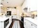 Modern kitchen featuring a large island, white cabinetry, stainless steel appliances, and an open layout at 436 Skyview Pl, Chuluota, FL 32766