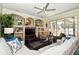 Inviting living room offers hardwood floors, a ceiling fan, and views of the outdoor landscape through glass sliding doors at 436 Skyview Pl, Chuluota, FL 32766