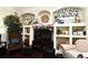 Living room with television and built-in shelving that is beautifully decorated at 436 Skyview Pl, Chuluota, FL 32766
