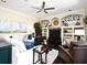 Comfortable living room features a ceiling fan, hardwood floors, and archways with decorations in built-in shelves at 436 Skyview Pl, Chuluota, FL 32766