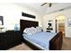 Bedroom displays a vaulted ceiling and carpet floors adjacent to the bathroom entrance at 436 Skyview Pl, Chuluota, FL 32766