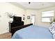 Bedroom featuring carpet floors, a ceiling fan, a dresser, and access to the outdoor landscape at 436 Skyview Pl, Chuluota, FL 32766