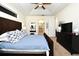 Bedroom with vaulted ceiling and carpet floors showcases an adjacent entrance to the bathroom at 436 Skyview Pl, Chuluota, FL 32766