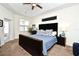 Bedroom featuring carpet floors, a ceiling fan, and a black dresser with an adjacent door leading to outdoor scenery at 436 Skyview Pl, Chuluota, FL 32766
