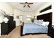 Bedroom features vaulted ceiling, a ceiling fan, and a dresser with an adjacent door leading to an outdoor area at 436 Skyview Pl, Chuluota, FL 32766