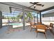 Covered patio features lovely outdoor seating with a ceiling fan and view of the backyard pool at 436 Skyview Pl, Chuluota, FL 32766