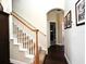 Traditional staircase with carpeted steps and wood railing leads to the upper level at 436 Skyview Pl, Chuluota, FL 32766